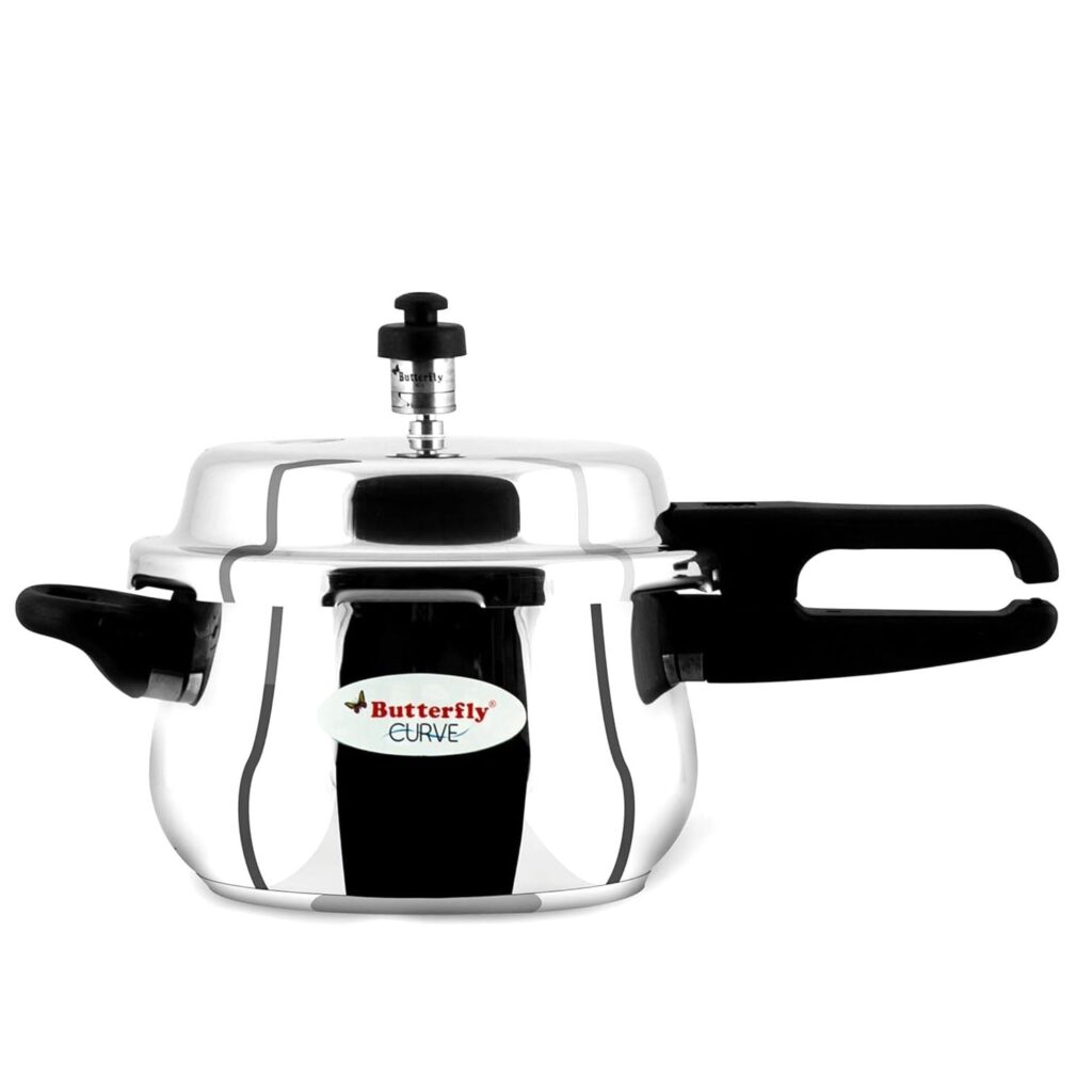 Aluminium pressure cooker with sturdy handle and safety valve on kitchen counter