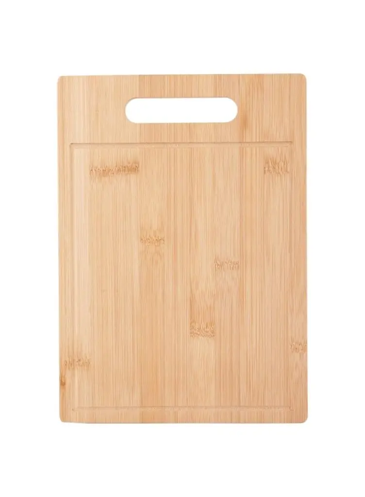 Wooden chopping board with fresh vegetables on kitchen counter